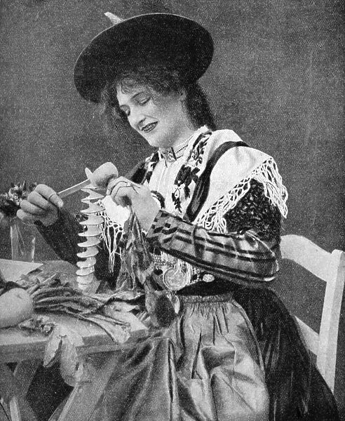 A woman creatively peeling a potato, 1922. Artist: Georg Haeckel