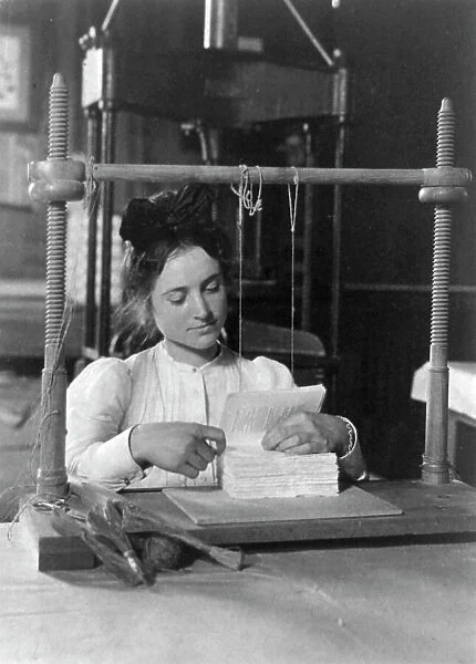 Woman doing bookbinding at Roycroft Shops, E. Aurora, N.Y. 1900. Creator: Frances Benjamin Johnston