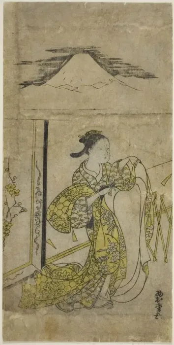 Framed Print : Woman Holding Kimono with Mt. Fuji above, c. 1740s. Creator: Nishimura Shigenaga Framed Print : Woman Holding Kimono with Mt. Fuji above, c. 1740s. Creator: Nishimura Shigenaga