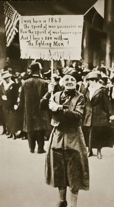 Framed Print : Woman holding a placard in support of the war effort, USA, World War I, c1914-c1918 Framed Print : Woman holding a placard in support of the war effort, USA, World War I, c1914-c1918