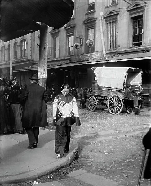 A woman in holiday attire, Chinatown, San Francisco, between 1896 and 1906. Creator: Arnold Genthe