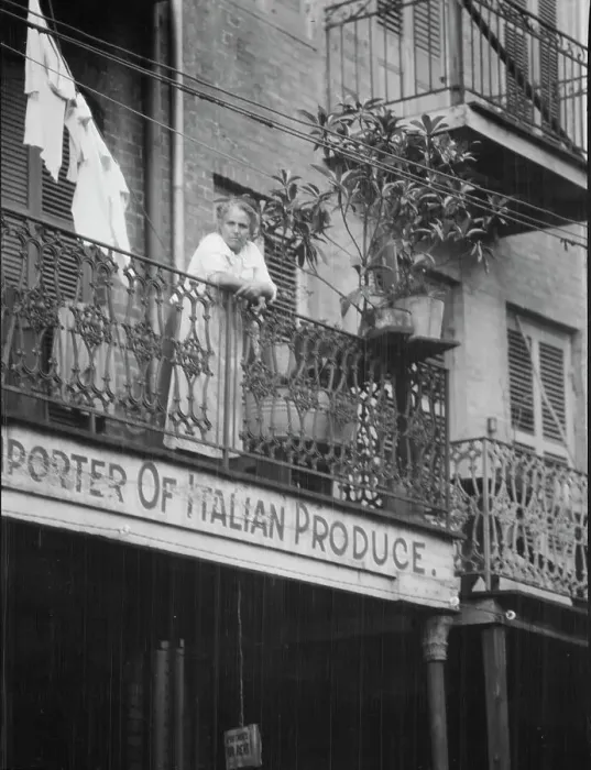 Framed Print : Woman leaning on a balcony, New Orleans, between 1920 and 1926. Creator: Arnold Genthe Framed Print : Woman leaning on a balcony, New Orleans, between 1920 and 1926. Creator: Arnold Genthe
