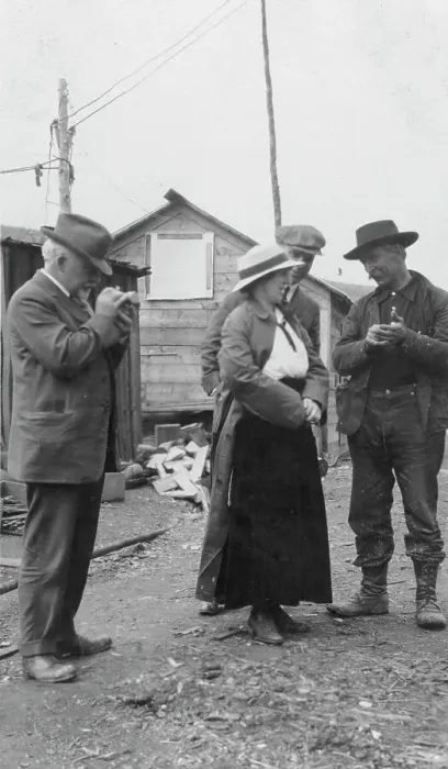 Framed Print : Woman and three men talking outside, between c1900 and 1916. Creator: Unknown Framed Print : Woman and three men talking outside, between c1900 and 1916. Creator: Unknown