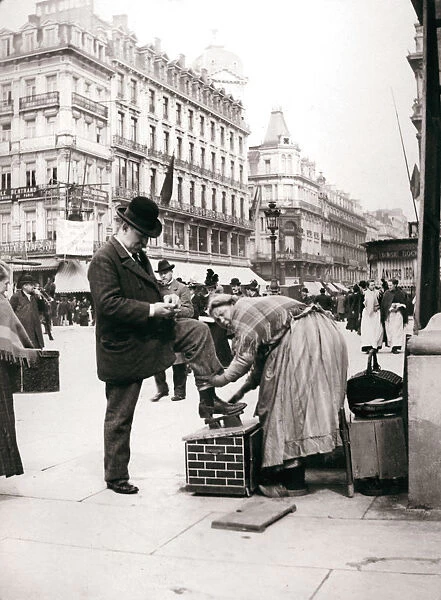 Woman polishing shoes, Brussels, 1898. Artist: James Batkin