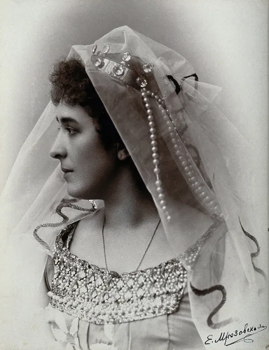 Framed Print : A woman posing in a photographic studio, wearing a bridal? dress and veil, in front of... 1900-1910 Creator: Unknown Framed Print : A woman posing in a photographic studio, wearing a bridal? dress and veil, in front of... 1900-1910 Creator: Unknown