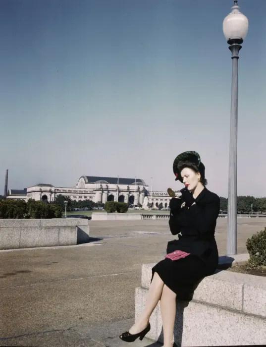 Framed Print : Woman putting on her lipstick in a park with Union Station behind her, Washington, D. C. ca. 1943. Creator: Unknown Framed Print : Woman putting on her lipstick in a park with Union Station behind her, Washington, D. C. ca. 1943. Creator: Unknown