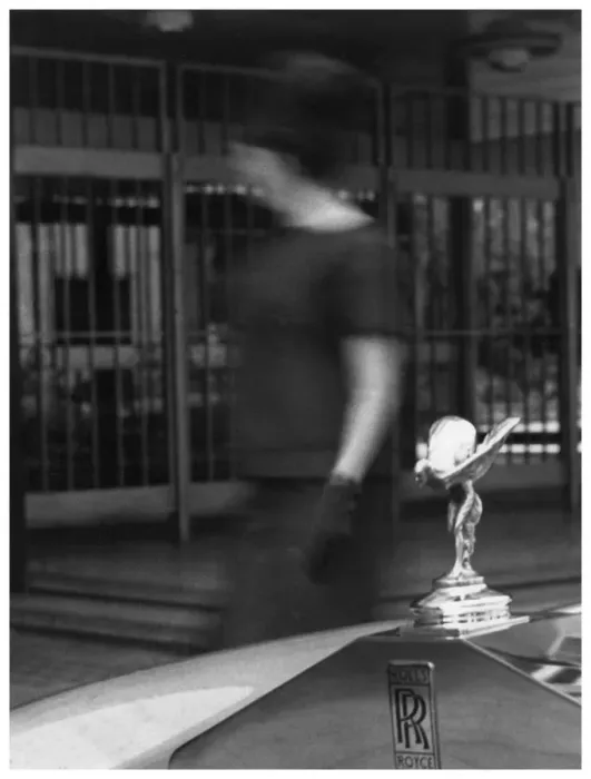 Framed Print : Woman walking past a Rolls-Royce Framed Print : Woman walking past a Rolls-Royce