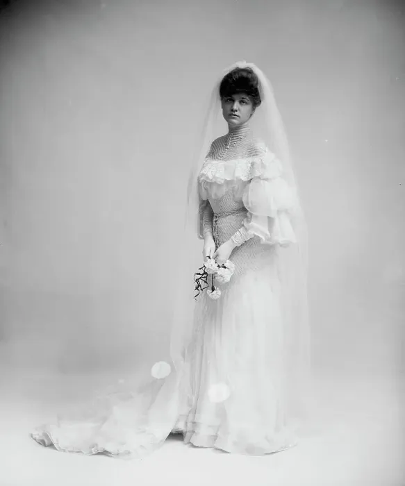 Framed Print : Woman in wedding dress holding flowers, between 1900 and 1910. Creator: Unknown Framed Print : Woman in wedding dress holding flowers, between 1900 and 1910. Creator: Unknown
