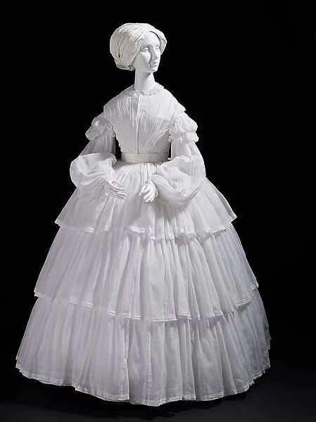 Woman's white muslin dress with tiered flounces, Europe, c.1855. Creator: Unknown