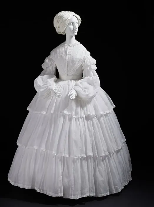 Framed Print : Woman's white muslin dress with tiered flounces, Europe, c.1855. Creator: Unknown Framed Print : Woman's white muslin dress with tiered flounces, Europe, c.1855. Creator: Unknown