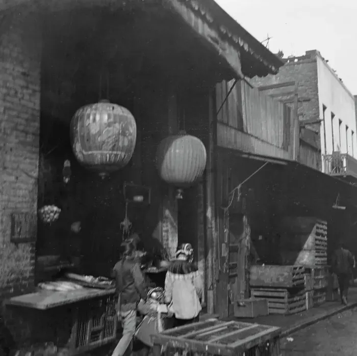 Framed Print : Two women and a child walking down a sidewalk betwen crates, Chinatown, San Francisco, c1896-1906. Creator: Arnold Genthe Framed Print : Two women and a child walking down a sidewalk betwen crates, Chinatown, San Francisco, c1896-1906. Creator: Arnold Genthe