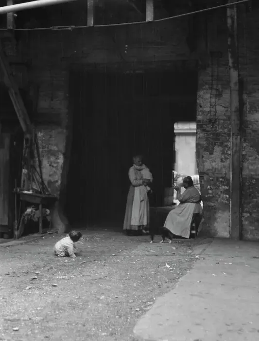 Framed Print : Women and children in a courtyard, New Orleans, between 1920 and 1926. Creator: Arnold Genthe Framed Print : Women and children in a courtyard, New Orleans, between 1920 and 1926. Creator: Arnold Genthe