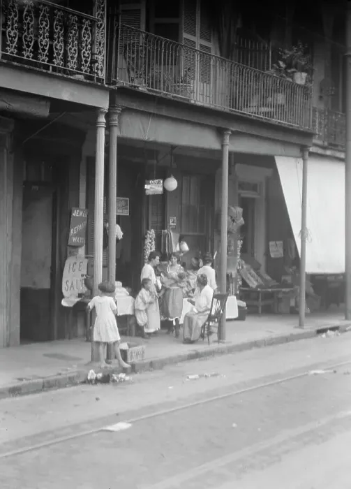 Framed Print : Women and children standing on a covered sidewalk, New Orleans, between 1920 and 1926. Creator: Arnold Genthe