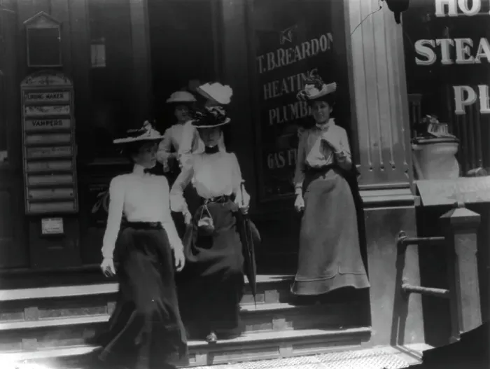 Framed Print : Women coming from work, Cal.?. Store window reads T.B. Reardon, heating and plumbing, 1903. Creator: Frances Benjamin Johnston Framed Print : Women coming from work, Cal.?. Store window reads T.B. Reardon, heating and plumbing, 1903. Creator: Frances Benjamin Johnston