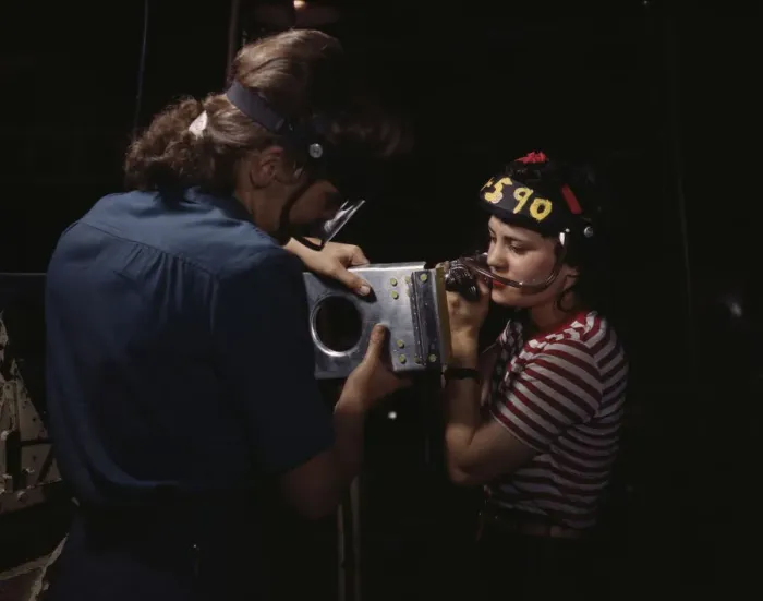 Framed Print : Two women employees of North American Aviation, Incorporated, assembling a section of a... 1942. Creator: Alfred T Palmer Framed Print : Two women employees of North American Aviation, Incorporated, assembling a section of a... 1942. Creator: Alfred T Palmer