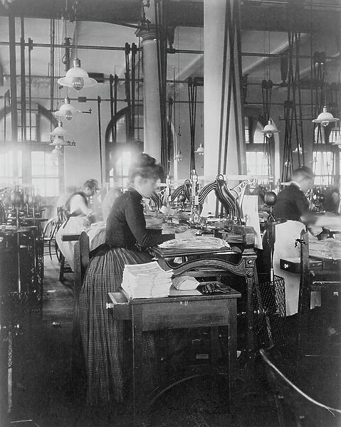 Women operating machinery at the Bureau of Printing and Engraving, Washington, D.C. 1889 or 1890. Creator: Frances Benjamin Johnston