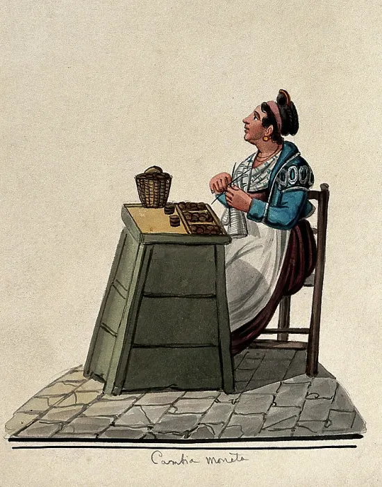 Framed Print : A women is sitting knitting at a table in the street with money on it in trays. Creator: Unknown Framed Print : A women is sitting knitting at a table in the street with money on it in trays. Creator: Unknown