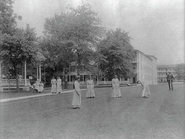 Women student activities - playing croquet, Carlisle Indian School, Carlisle, Pennsylvania, 1901. Creator: Frances Benjamin Johnston