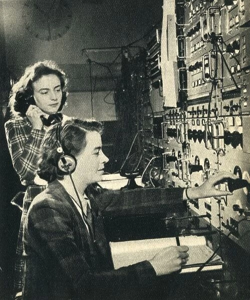 Women have taken over mens jobs. BBC control room as a programme goes on air 1942