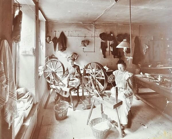 Women using spinning wheels, Bethnal Green, London, 1908