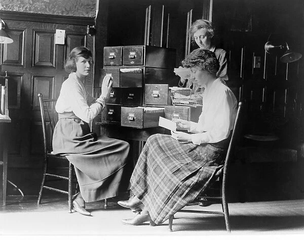 Three women work at the card index files at the headquarters of the National Womans Party, c