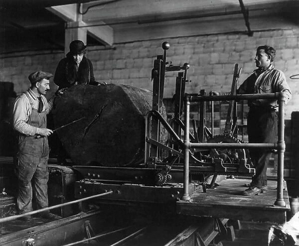 Wooden box industry - Mrs. Graham inspecting log on machinery with two workmen standing by, c1910. Creator: Frances Benjamin Johnston