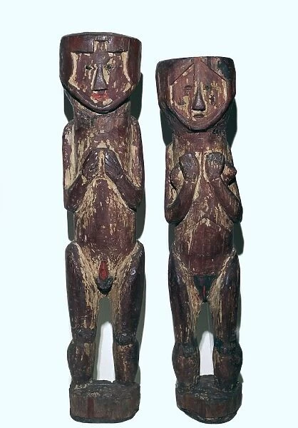 Wooden figures of men and women from north-east Peru