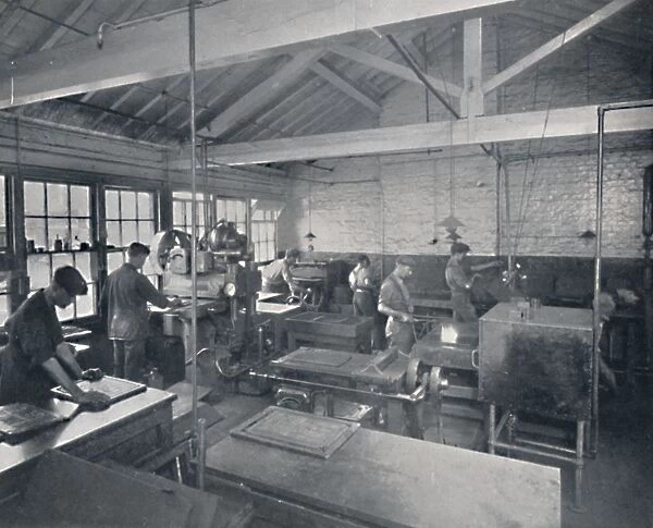 At Work in the Foundry. Making Wax Moulds of the Pages, 1917