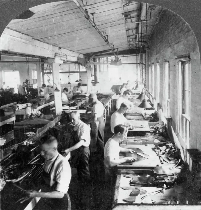 Framed Print : Workers cutting leather for shoes in a factory, Lynn, Massachusetts, USA, 20th century. Artist: Keystone View Company Framed Print : Workers cutting leather for shoes in a factory, Lynn, Massachusetts, USA, 20th century. Artist: Keystone View Company
