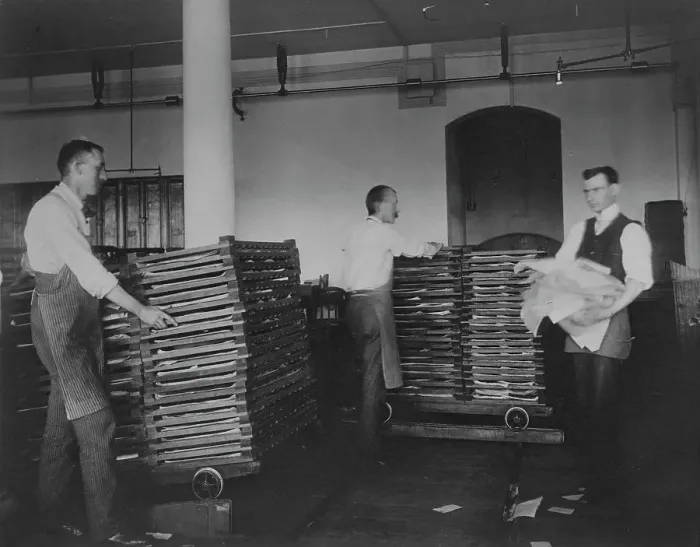 Framed Print : Workers moving newly printed currency into a drying box where sheets will dry before...c1890. Creator: Frances Benjamin Johnston Framed Print : Workers moving newly printed currency into a drying box where sheets will dry before...c1890. Creator: Frances Benjamin Johnston