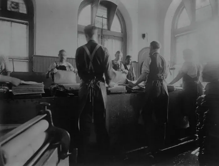 Framed Print : Workers wetting sheets prior to printing paper money at the Bureau of Engraving & Printing, c1895. Creator: Frances Benjamin Johnston. Workers wetting sheets prior to printing paper money at the Bureau of Engraving & Printing, c1895 Framed Print : Workers wetting sheets prior to printing paper money at the Bureau of Engraving & Printing, c1895. Creator: Frances Benjamin Johnston. Workers wetting sheets prior to printing paper money at the Bureau of Engraving & Printing, c1895