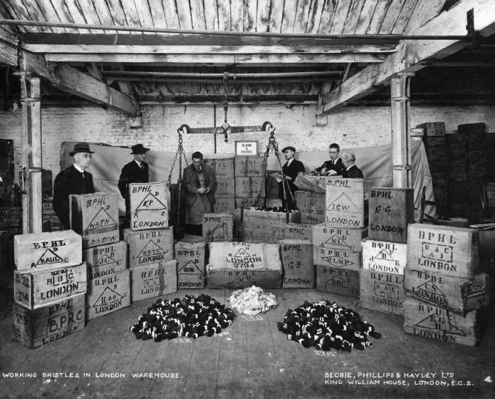 Framed Print : Working with bristles in a warehouse, London, 1938 Framed Print : Working with bristles in a warehouse, London, 1938