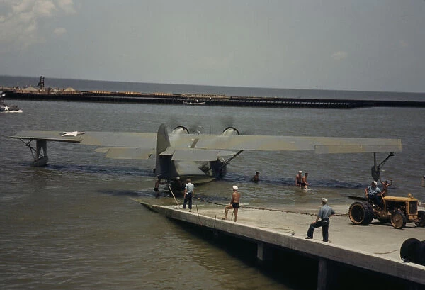 Working with a sea-plane at the Naval Air Base, Corpus Christi, Texas, 1942. Creator: Howard Hollem