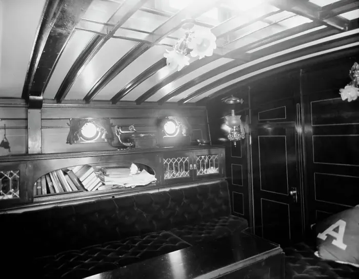 Framed Print : Yacht Althea, cabin, showing books, between 1907 and 1915. Creator: Unknown Framed Print : Yacht Althea, cabin, showing books, between 1907 and 1915. Creator: Unknown