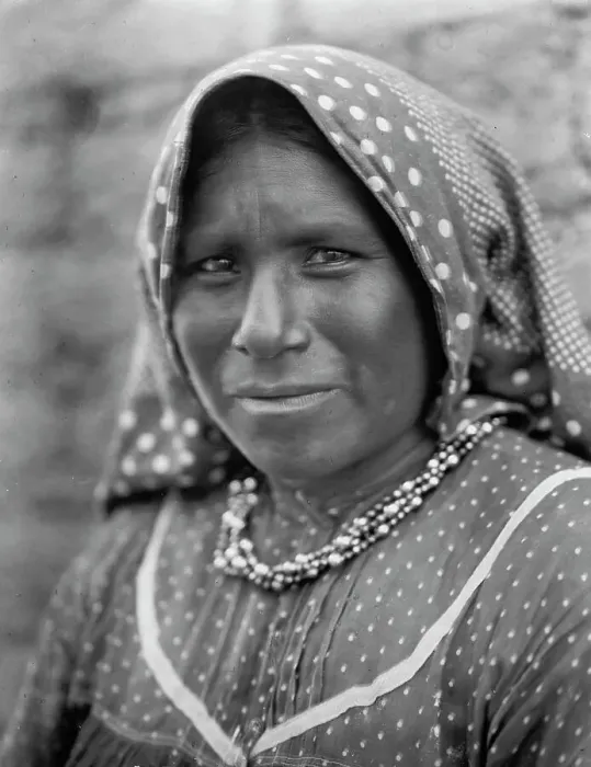 Framed Print : Yaqui matron, head-and-shoulders portrait, facing slightly left, wearing printed cotton... c1907. Creator: Edward Sheriff Curtis