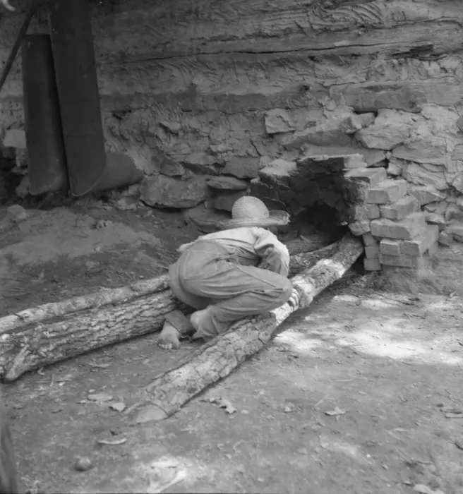 Framed Print : Ten year old son of tobacco tenant tends the fire... Granville County, North Carolina, 1939. Creator: Dorothea Lange Framed Print : Ten year old son of tobacco tenant tends the fire... Granville County, North Carolina, 1939. Creator: Dorothea Lange