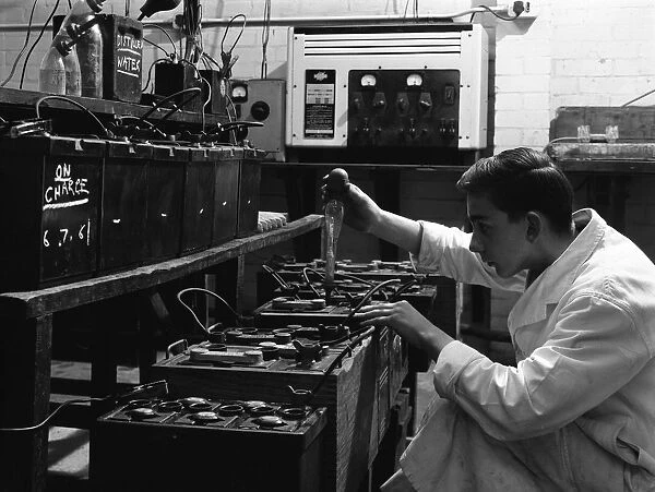 A young apprentice at Globe & Simpson auto electricians workshop, Lincoln, Lincolnshire, 1961