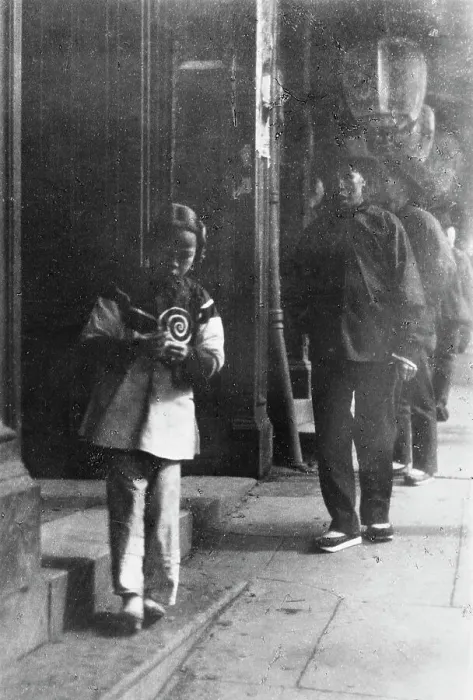 Framed Print : Young girl walking down a street, Chinatown, San Francisco, between 1896 and 1906. Creator: Arnold Genthe Framed Print : Young girl walking down a street, Chinatown, San Francisco, between 1896 and 1906. Creator: Arnold Genthe