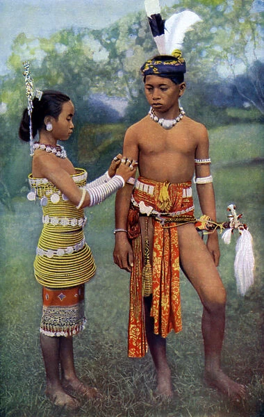 Young Iban or Sea Dayaks people in gala attire, Borneo, 1922. Artist: Dr Charles Hose