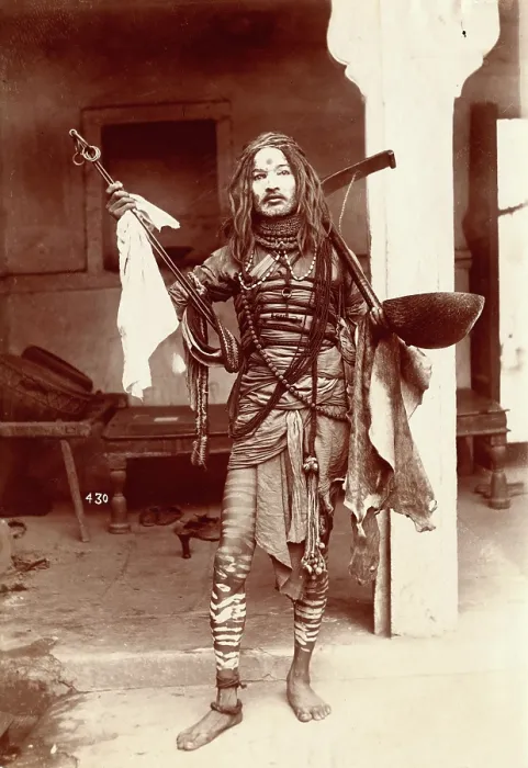 Framed Print : A young Indian man wearing many beads and makeup in a temple precinct, c1900. Creator: Unknown Framed Print : A young Indian man wearing many beads and makeup in a temple precinct, c1900. Creator: Unknown