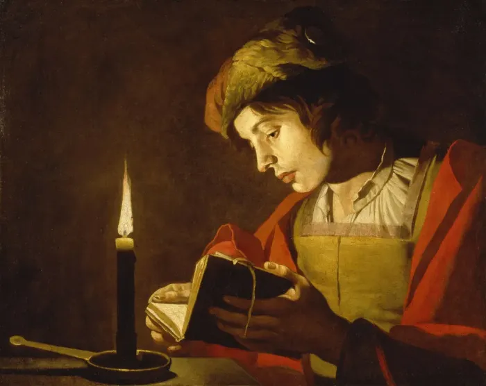 Framed Print : A Young Man Reading by Candlelight, c. 1630 Framed Print : A Young Man Reading by Candlelight, c. 1630