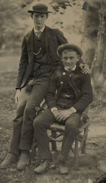 Two Young Men Outdoors, One Seated, the Other on the Arm of the Chair, 1880s