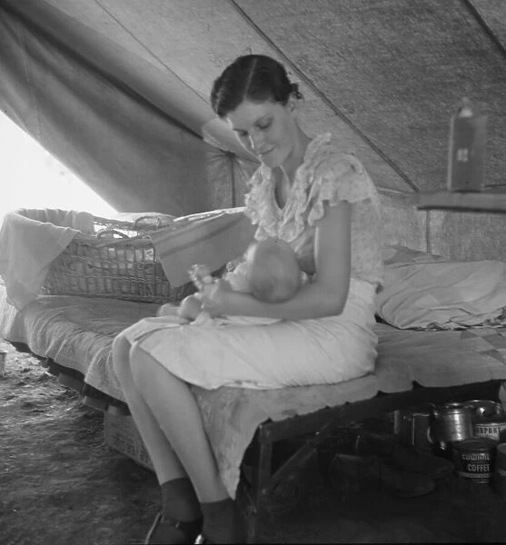 Young migrant mother with six weeks old baby born in a hospital, near Westley, CA, 1939. Creator: Dorothea Lange