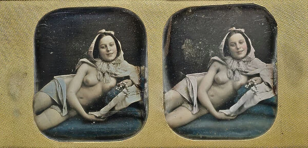 Young scantily clad woman, lying on her side. Creator: Unknown