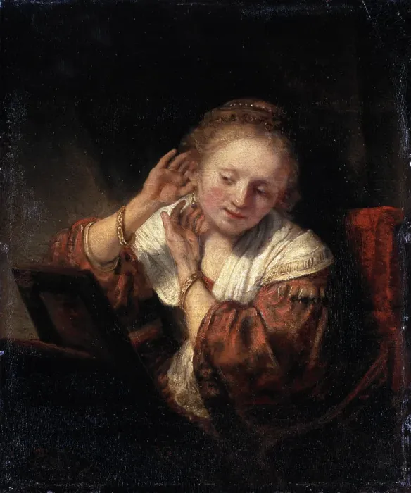 Framed Print : Young Woman trying on Earrings, 1657. Artist: Rembrandt Harmensz van Rijn Framed Print : Young Woman trying on Earrings, 1657. Artist: Rembrandt Harmensz van Rijn