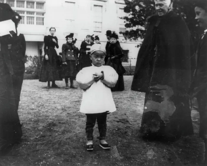 Framed Print : One of the youngest egg rollers on the White House lawn, 1898. Creator: Frances Benjamin Johnston Framed Print : One of the youngest egg rollers on the White House lawn, 1898. Creator: Frances Benjamin Johnston