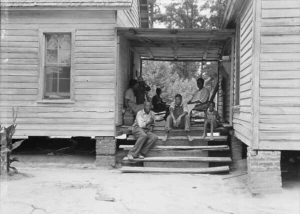 Zollie Lyons, Negro sharecropper, home from the field for dinner... Upchurch, North Carolina, 1939. Creator: Dorothea Lange