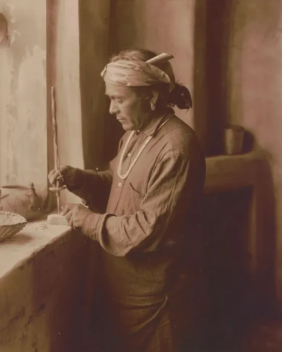 Framed Print : Zuni Indian bead worker drilling holes in beads, c1903. Creator: Edward Sheriff Curtis Framed Print : Zuni Indian bead worker drilling holes in beads, c1903. Creator: Edward Sheriff Curtis