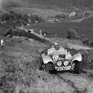 1936 Jaguar SS100 taking part in the NWLMC Lawrence Cup Trial, 1937. Artist: Bill Brunell