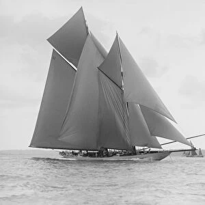 The 250 ton schooner Germania sails on a reach, 1913. Creator: Kirk & Sons of Cowes